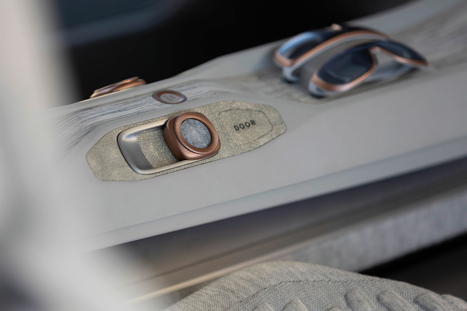 Close-up of an elegant control element in a futuristic vehicle interior.