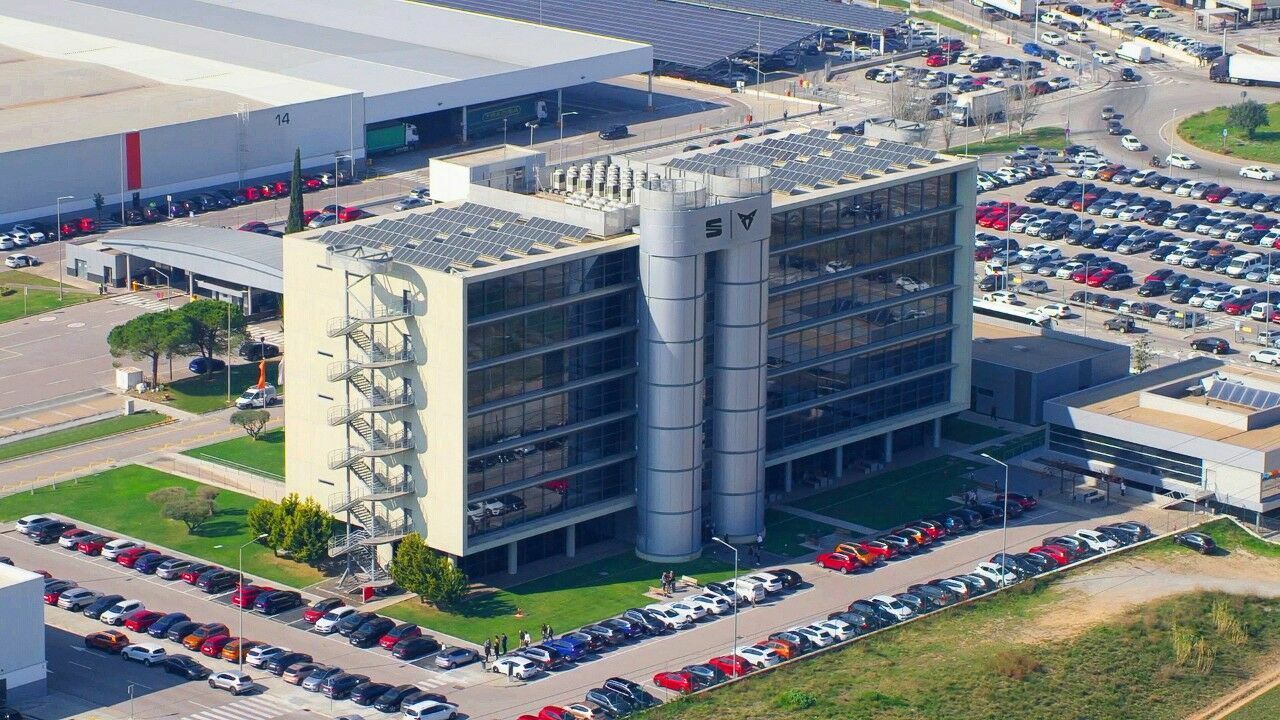 Aerial view of a Volkswagen Group company building, with some cars around the building