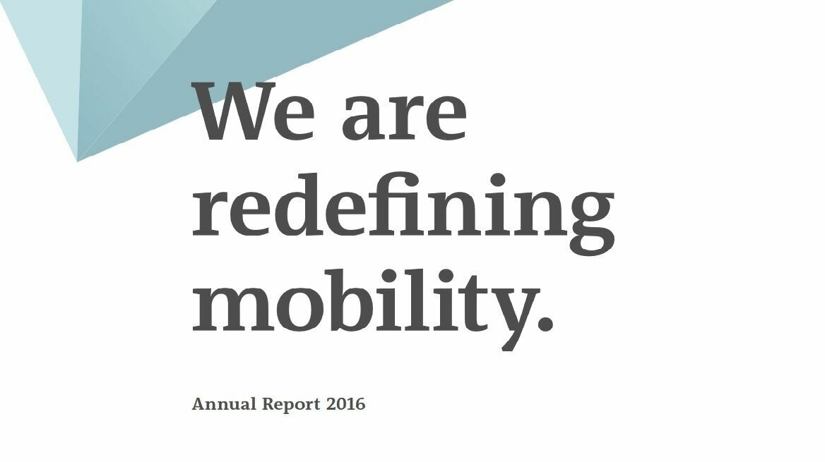 Graphic design featuring the slogan "We redefine mobility." with the note "Annual Report 2016", styled in white, gray, and blue tones.