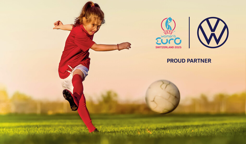A girl in a red jersey kicks a football on a grassy field at sunset. On the right, logos of UEFA Women’s EURO 2025 and Volkswagen with the text “Proud Partner”.