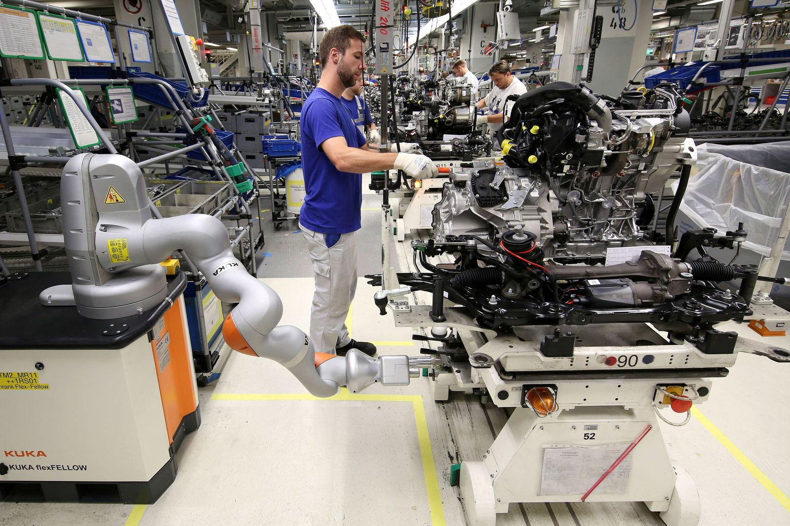 Golf production at Wolfsburg plant - people and robots work hand-in-hand